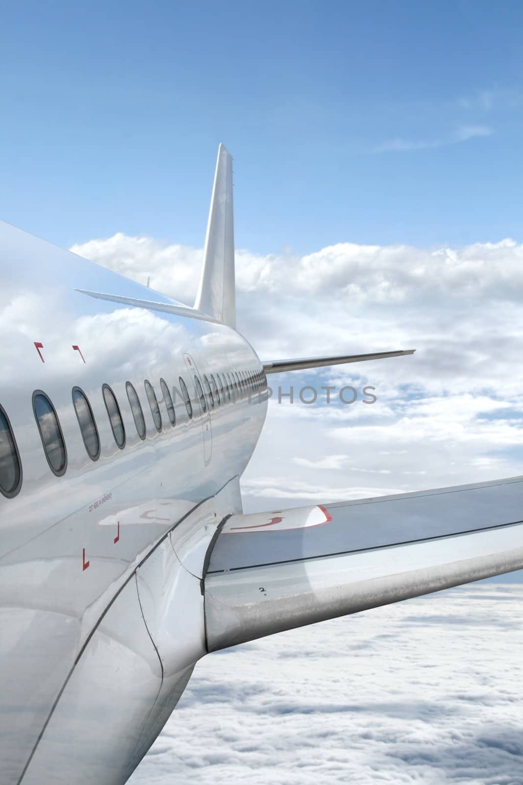 Airplane Flying above the Clouds