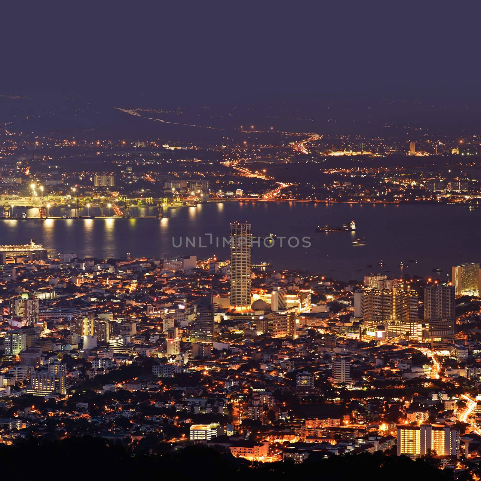 City night scene of harbor and tower in Penang, Malaysia, Asia.
