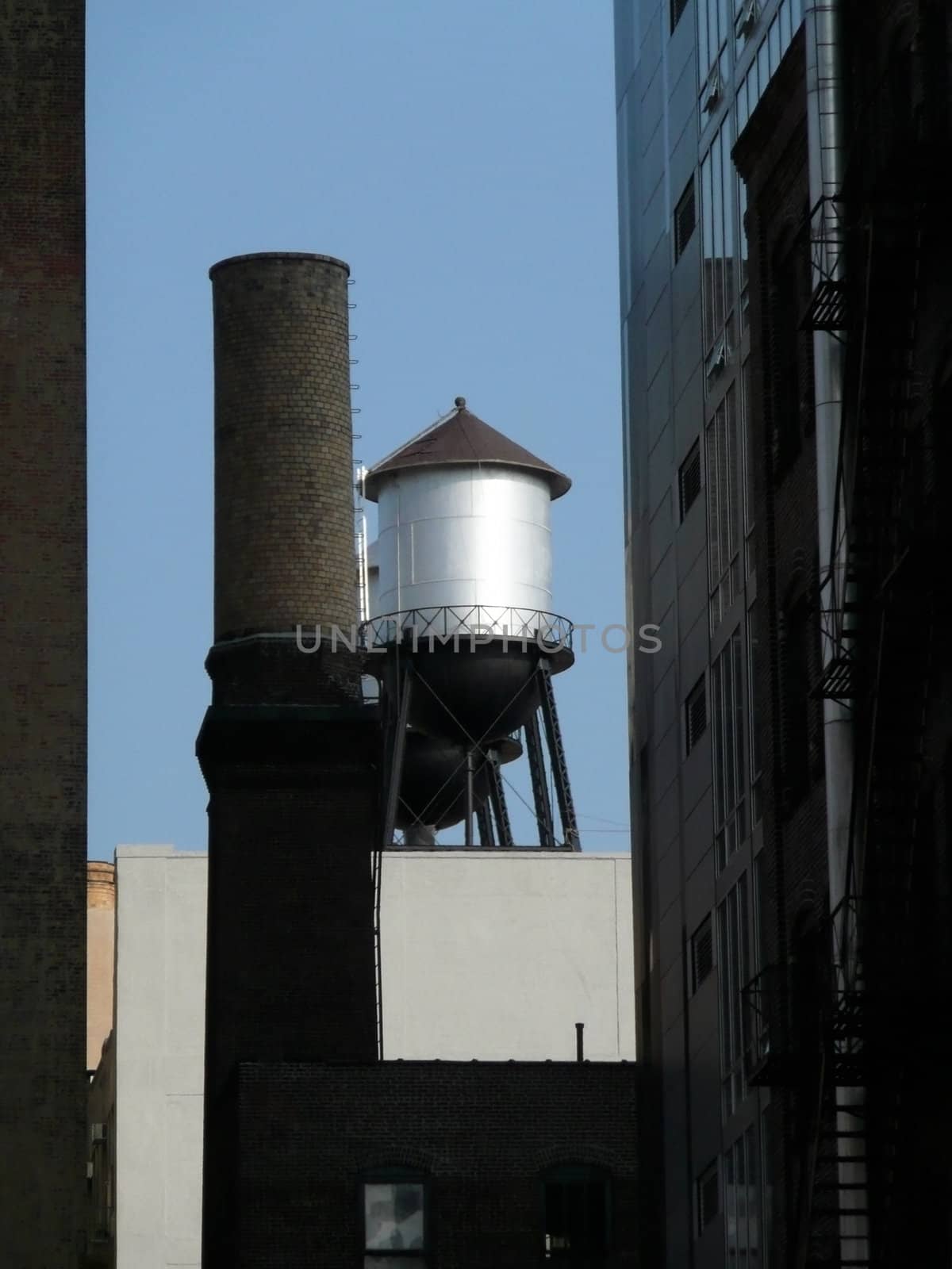 Water tank atop Manhattan building by daboost