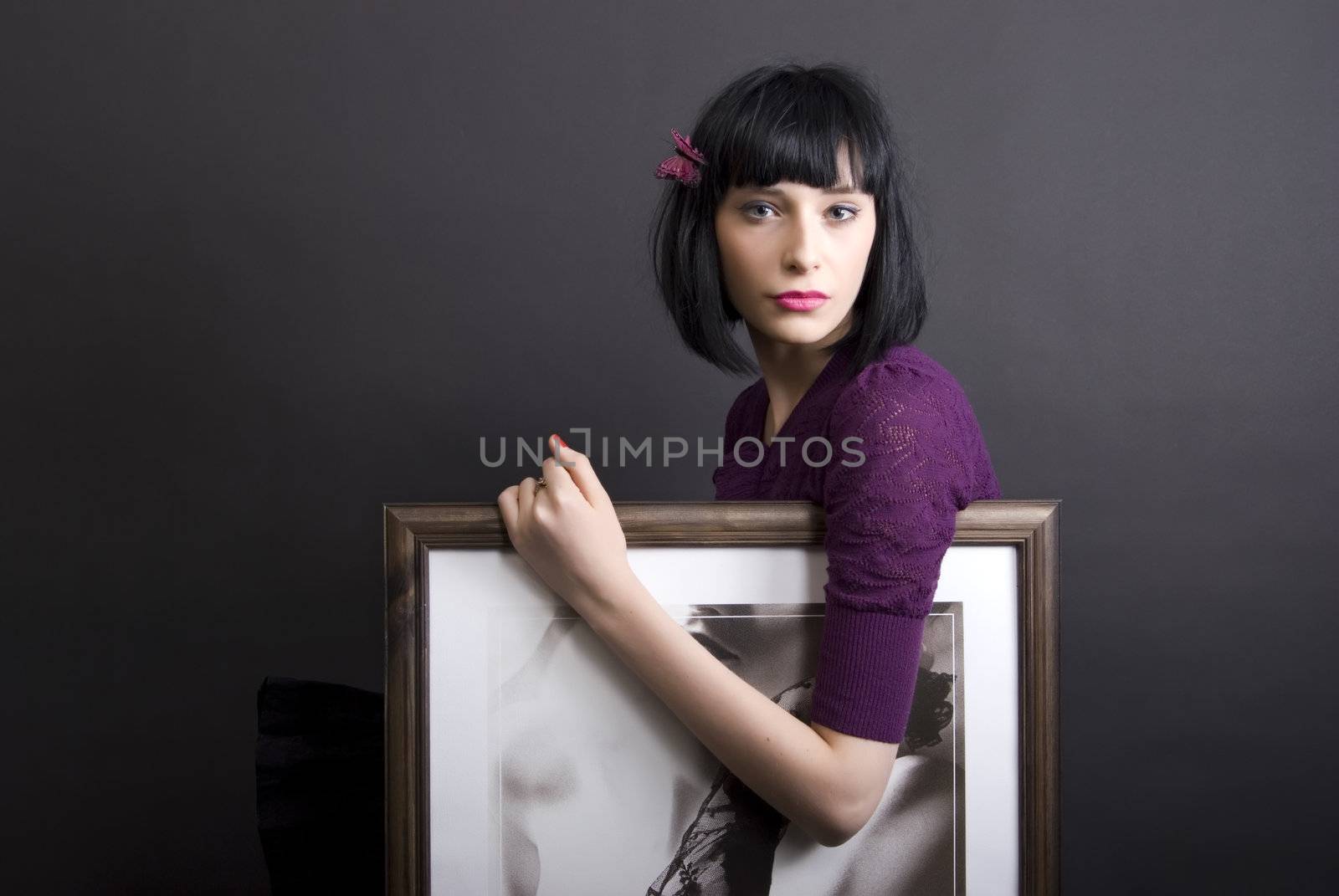 young girl with painting over black