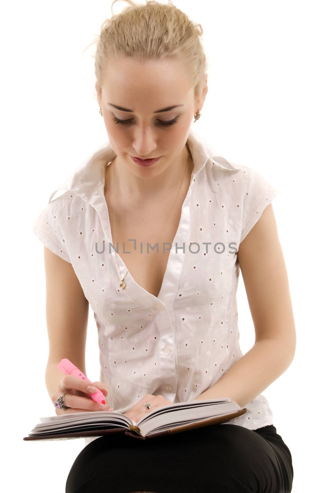 Young beautiful blonde posing with notebook  