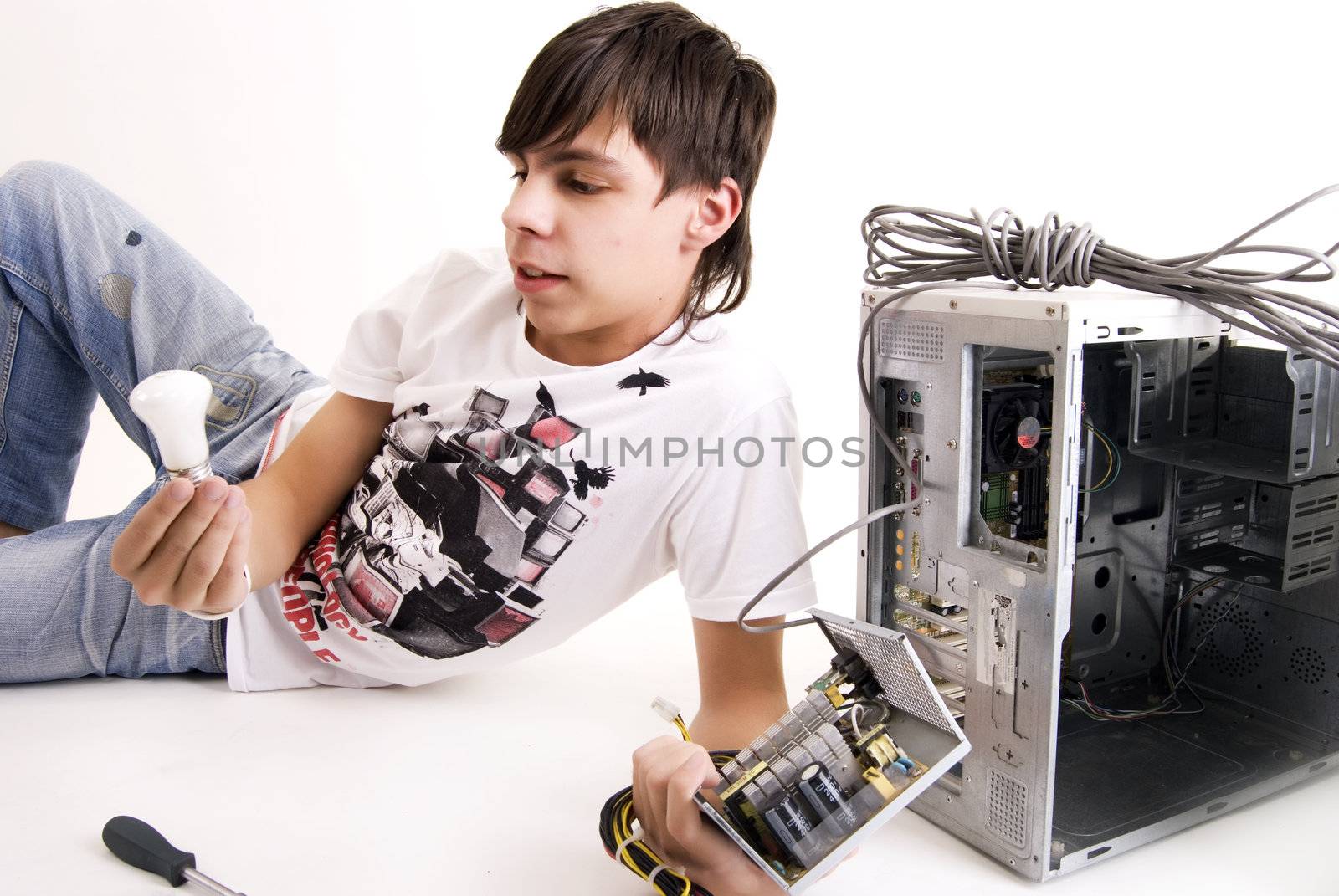 young man repairing his computer
