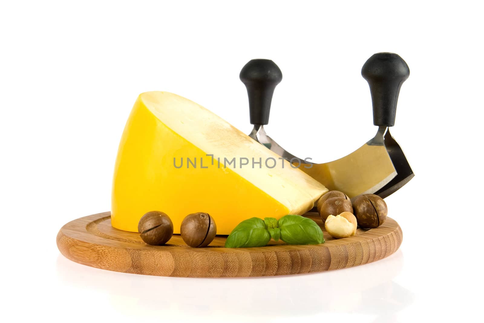 a kilogramm cheese, a cheese slicer and nuts