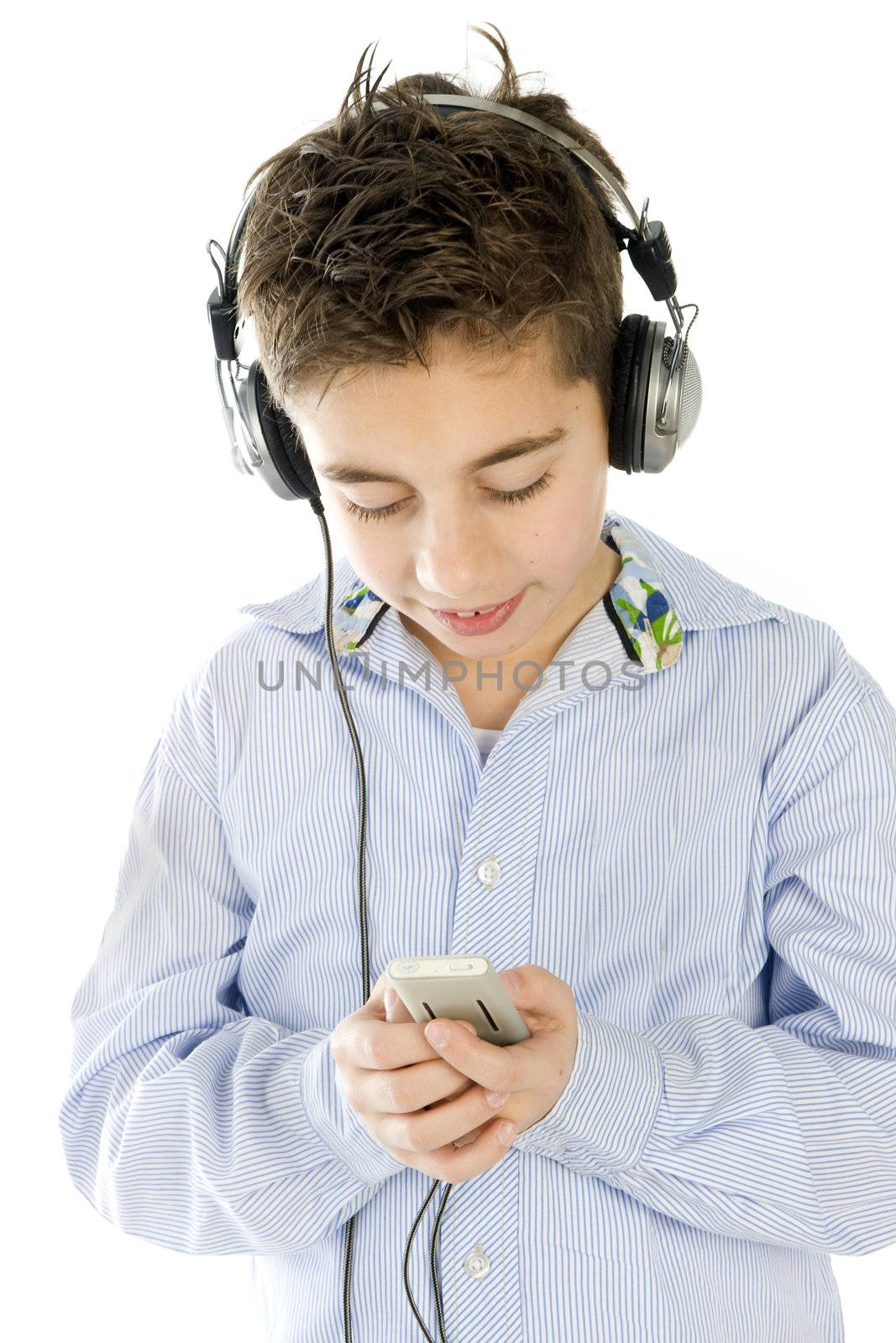 a boy listining to music with a headphone and a mp3-player