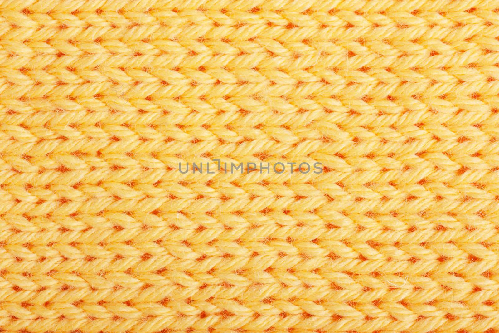 Macro view of yellow knitting. Horizontal orientation