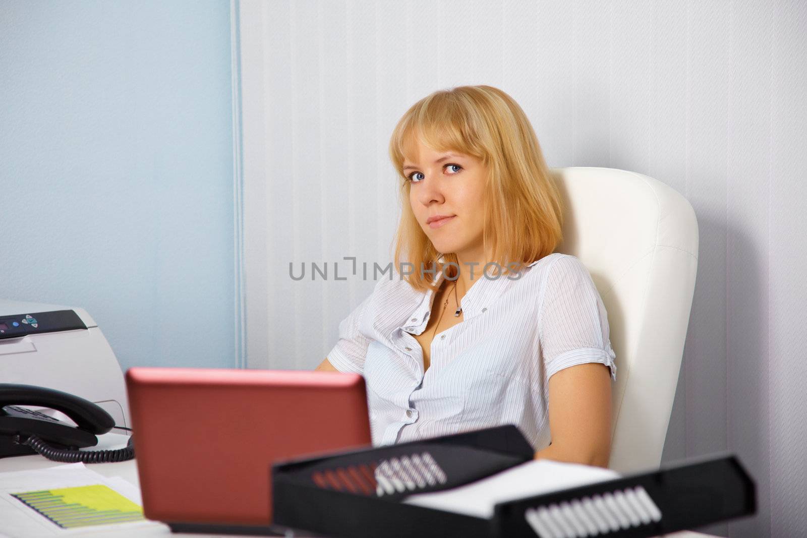 The young secretary in the office workplace