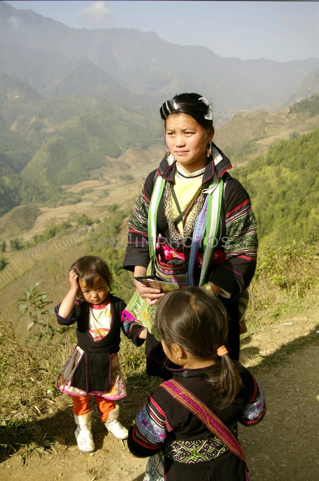 Woman of the ethnic (minority) Hmong black region of SAPA. She carries a baby in the back. She is 27 and already has two other children