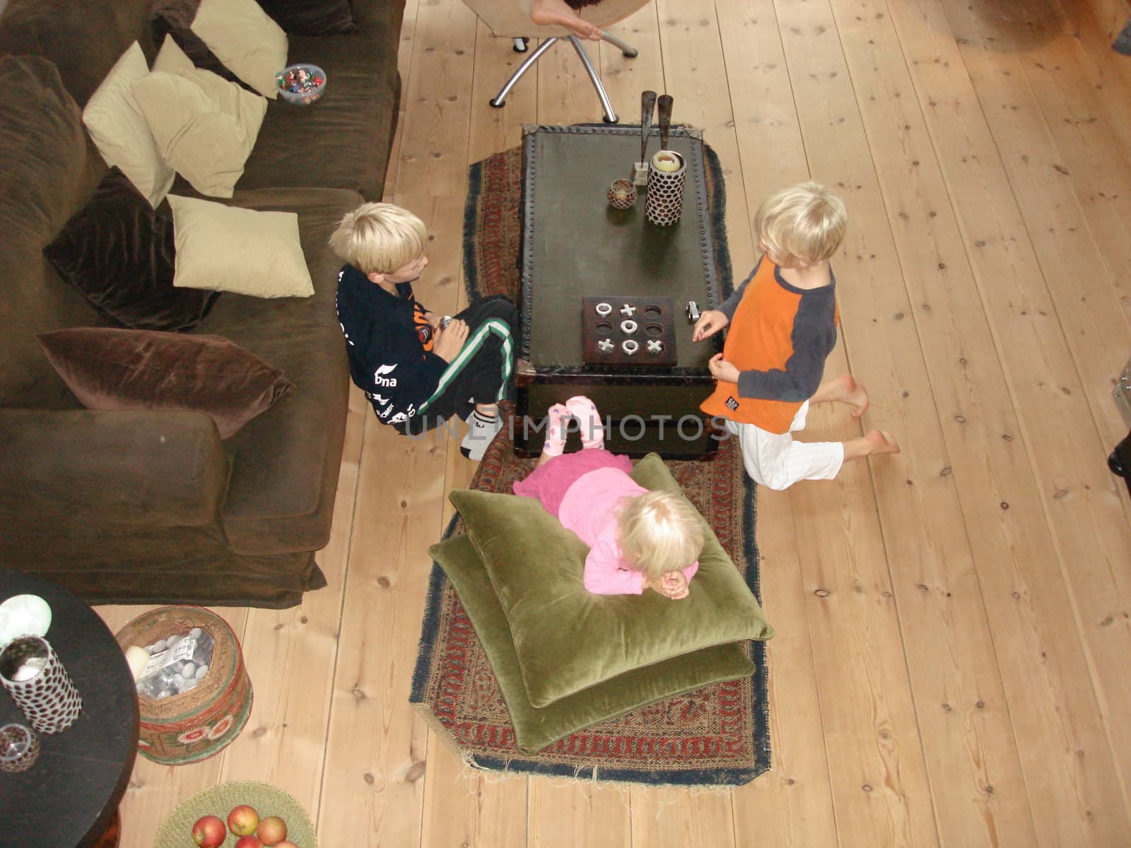 scandinavian life-boys playing in the living room by Bildehagen