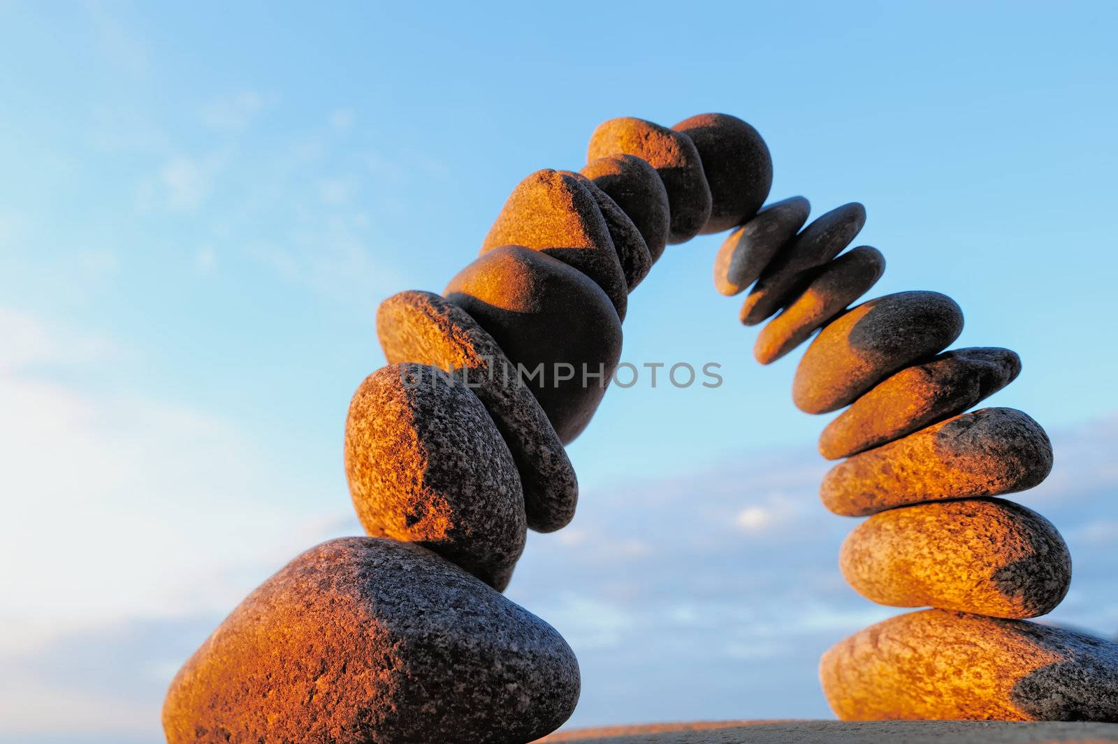 Pebbles stacked one on top of another as arch