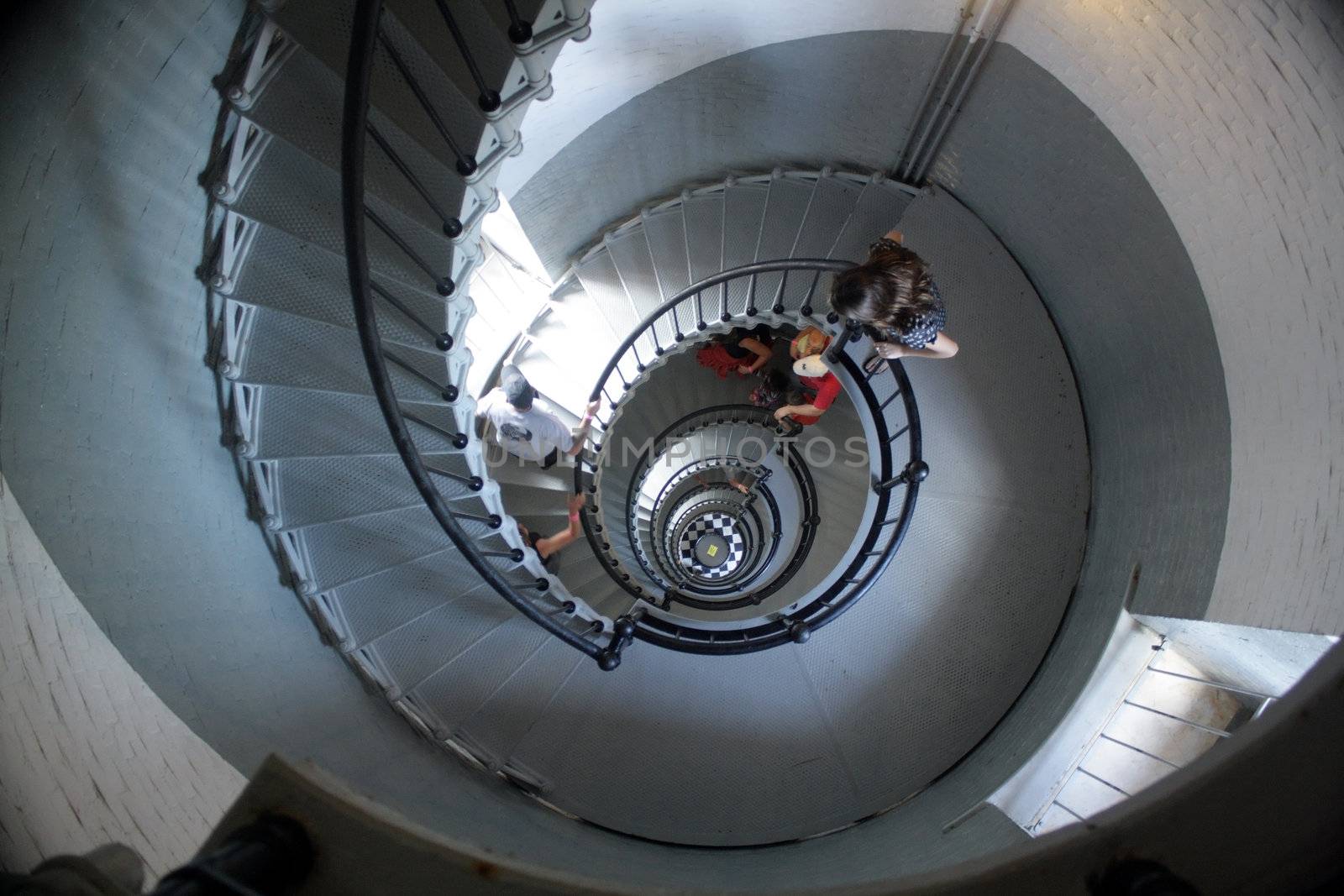 Looking down from the top of a spiral stairway over 200 feet tall.