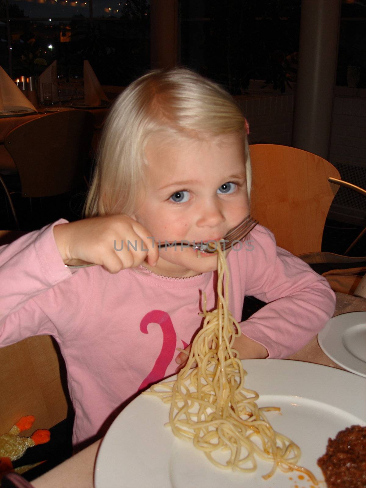 Scandinavian Lifestyle-girl having noodles by Bildehagen