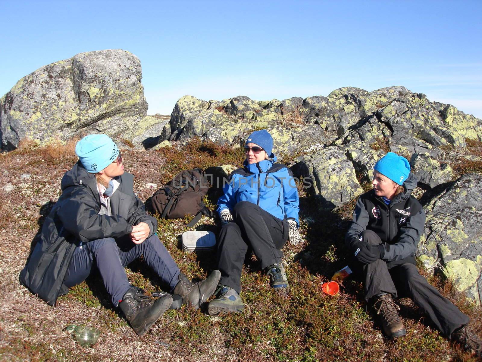 Scandinavian Lifestyle-hikers taking a rest by Bildehagen