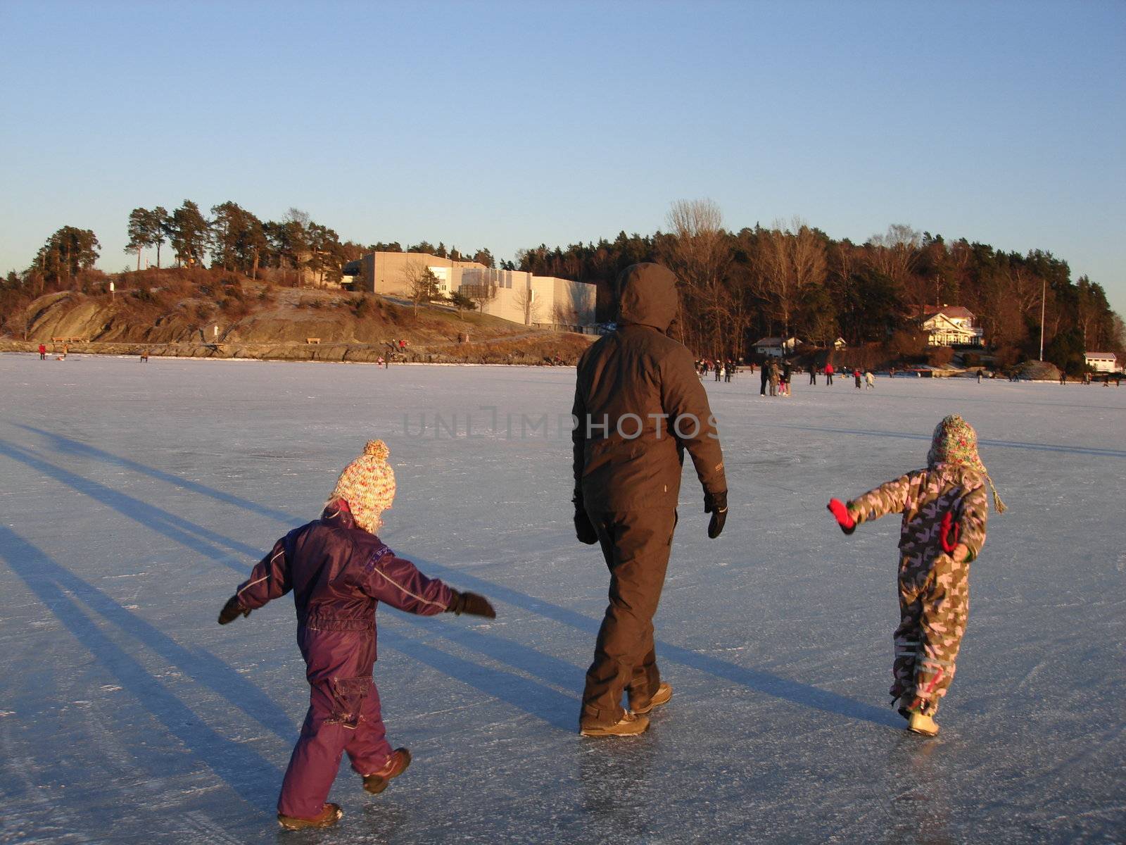 Scandinavian Lifestyle-walking on the frozen lake by Bildehagen