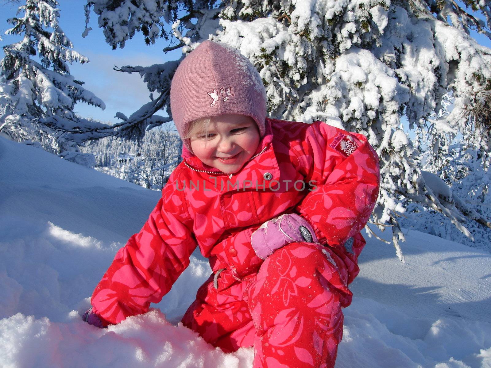 Scandinavian Lifestyle-girl playing with snow by Bildehagen