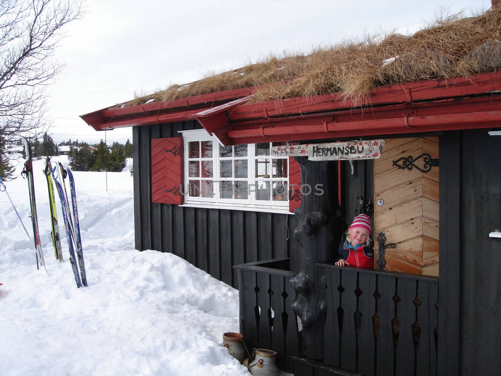 Scandinavian Lifestyle-girl in front of the house by Bildehagen