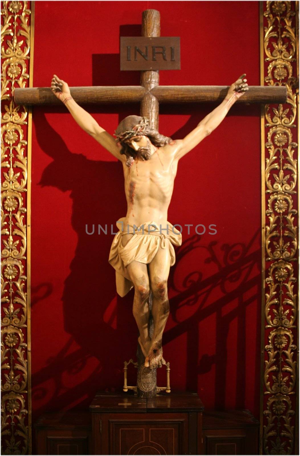 jesus on a cross over the red background
