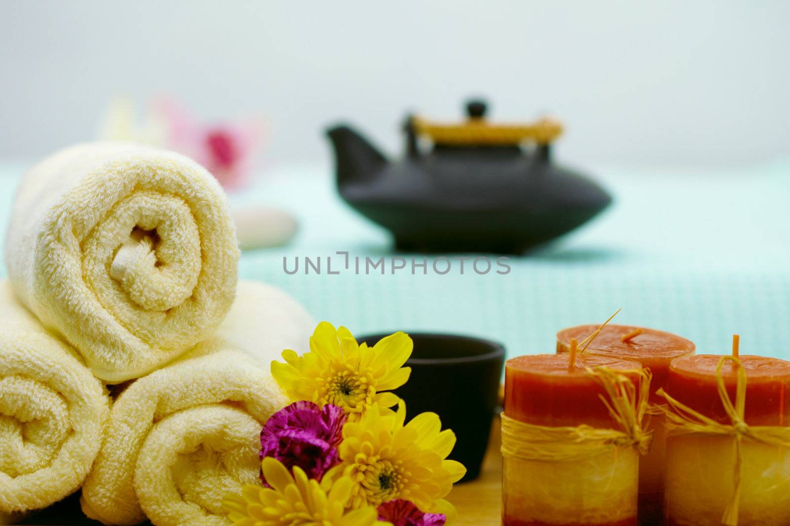 The composition of teapot, towels and candles - spa