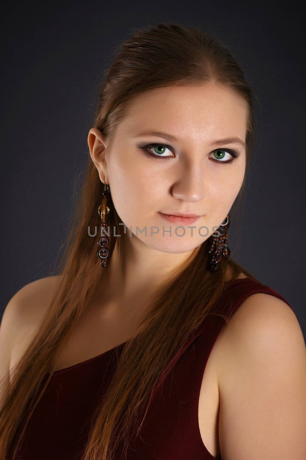 Portrait of a beautiful young woman with red hair