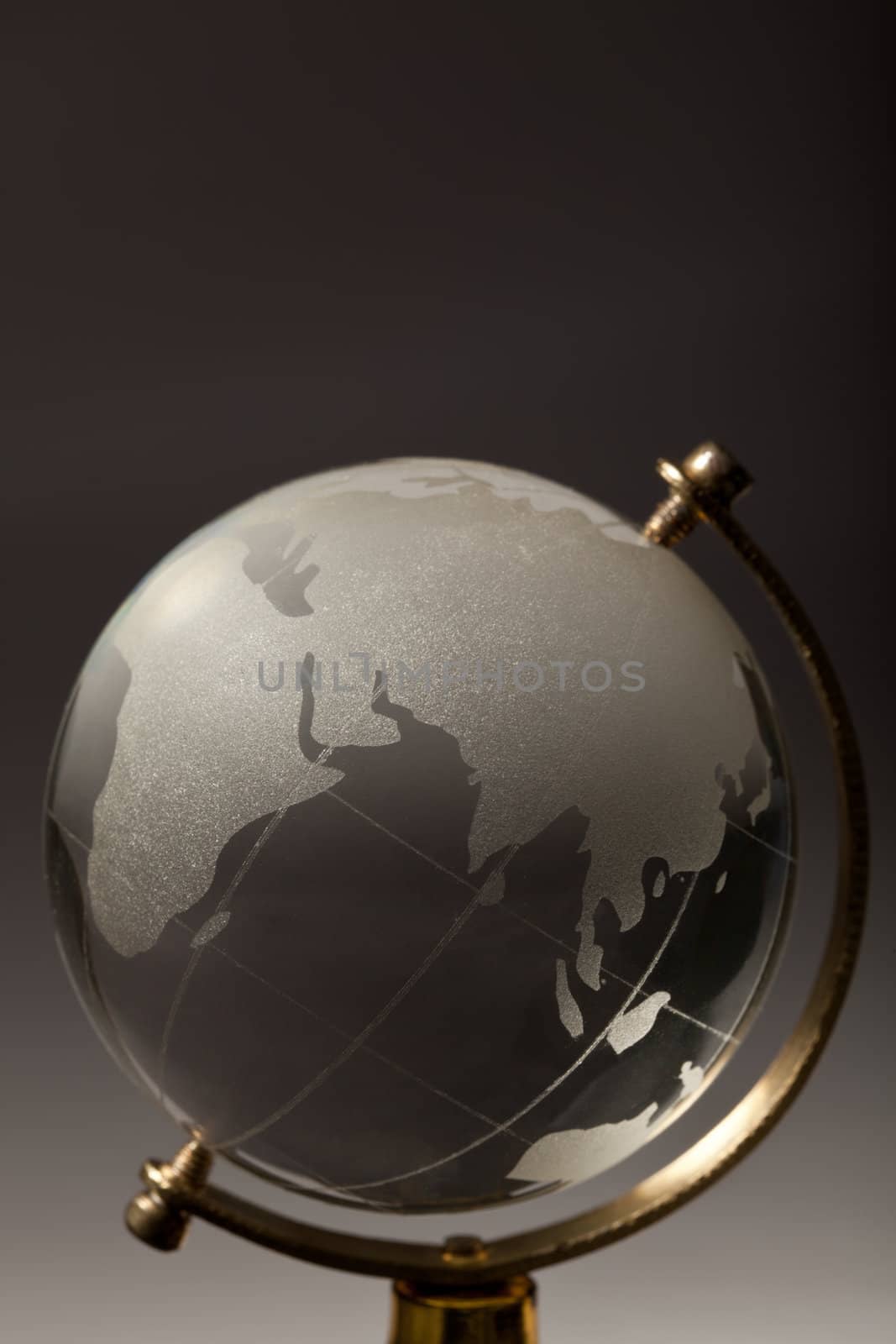 Crystal glass globe on gradient gray background
