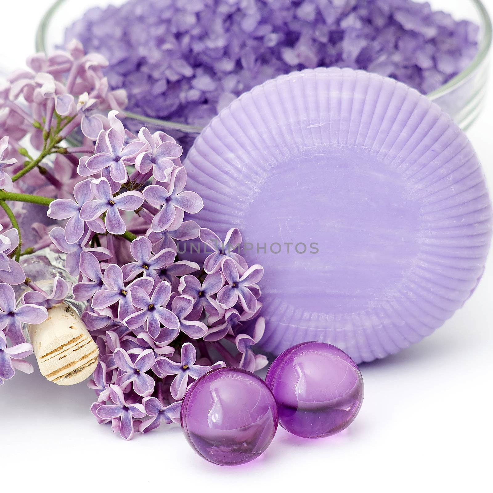 spa products and lilac flowers by miradrozdowski