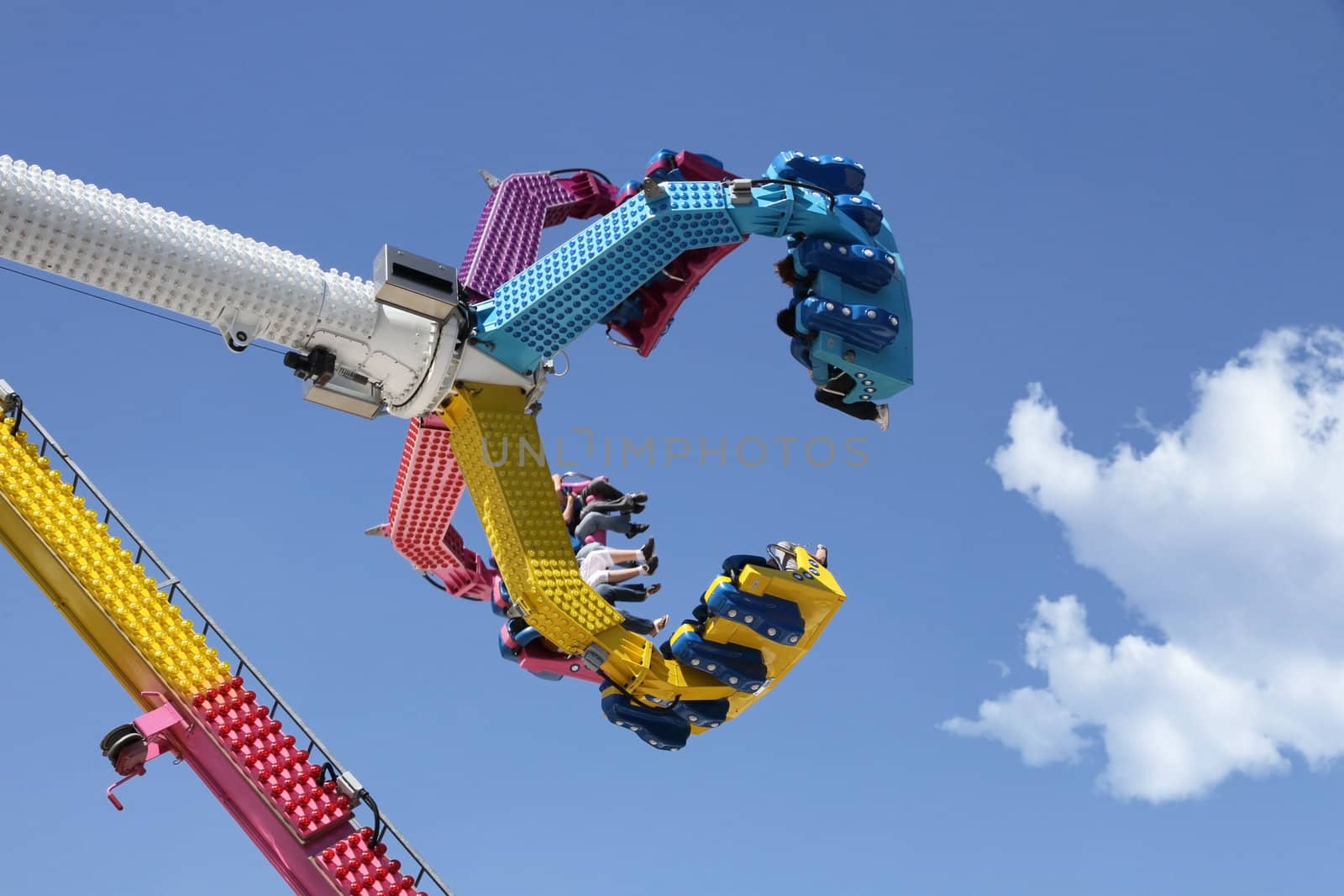 amusement park ride against blue sky