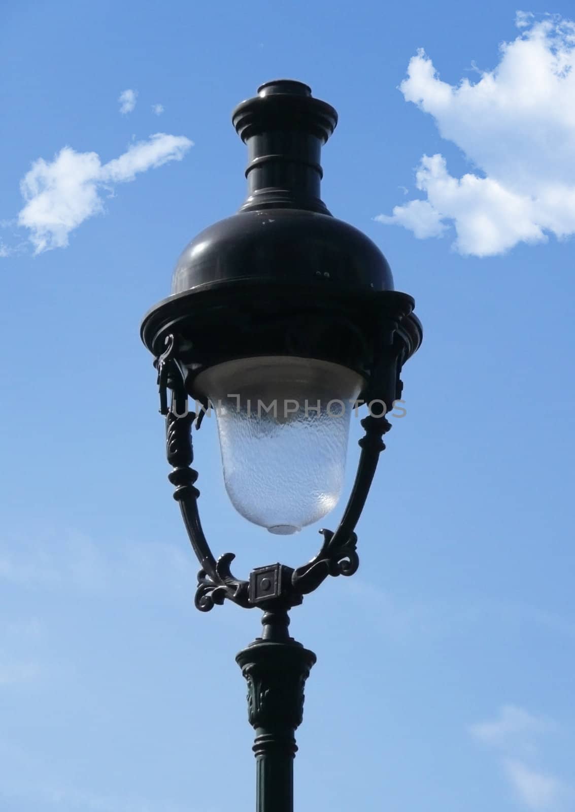 old 1900's Street lamp on a blue sky