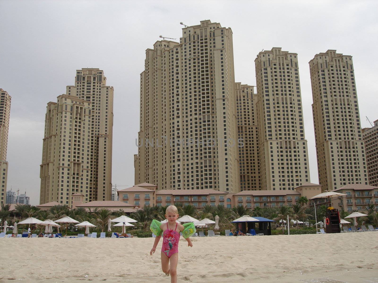 girl playing on the beach of Dubai