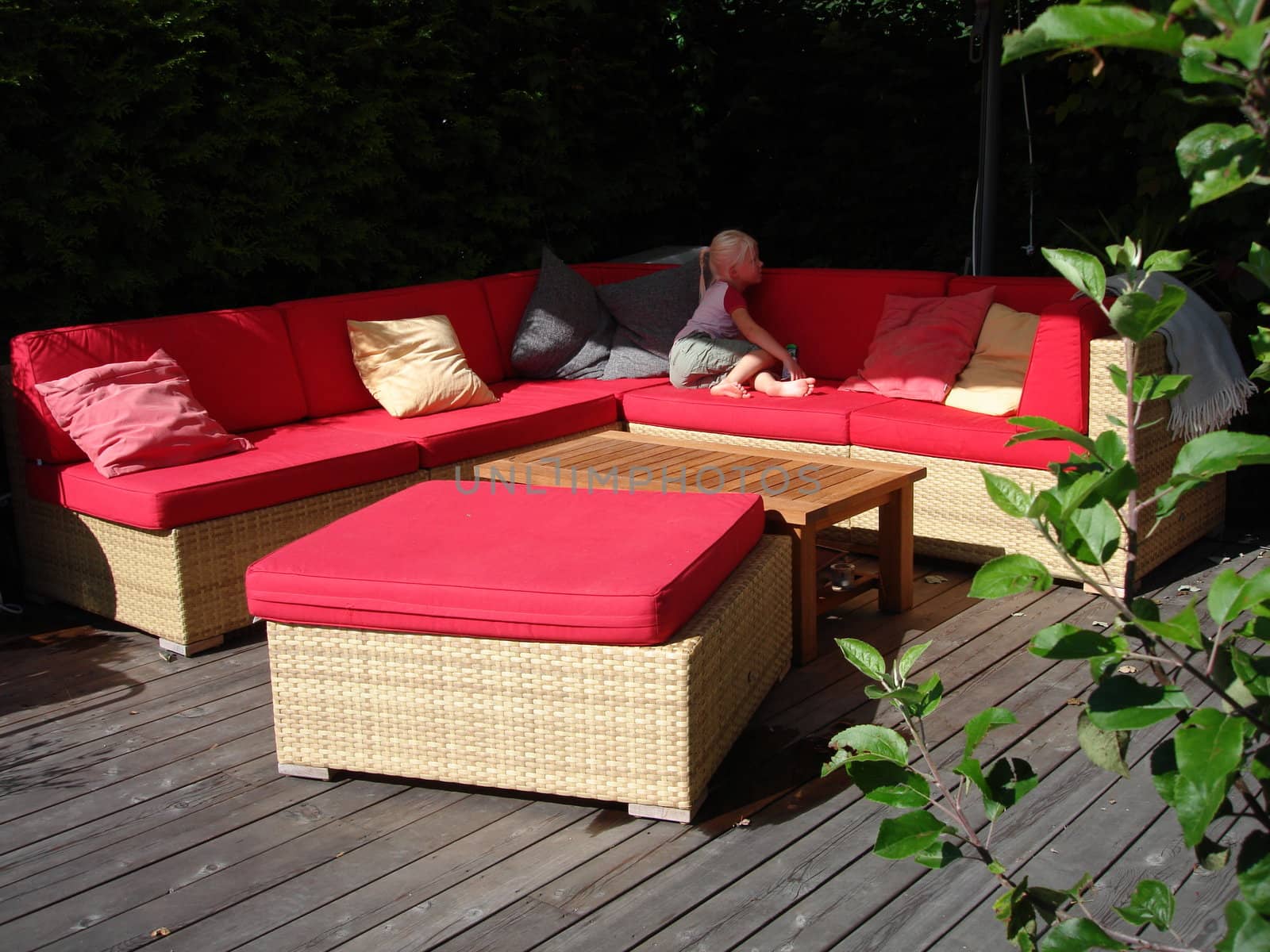 Scandinavian Lifestyle-red sofa outdoor by Bildehagen