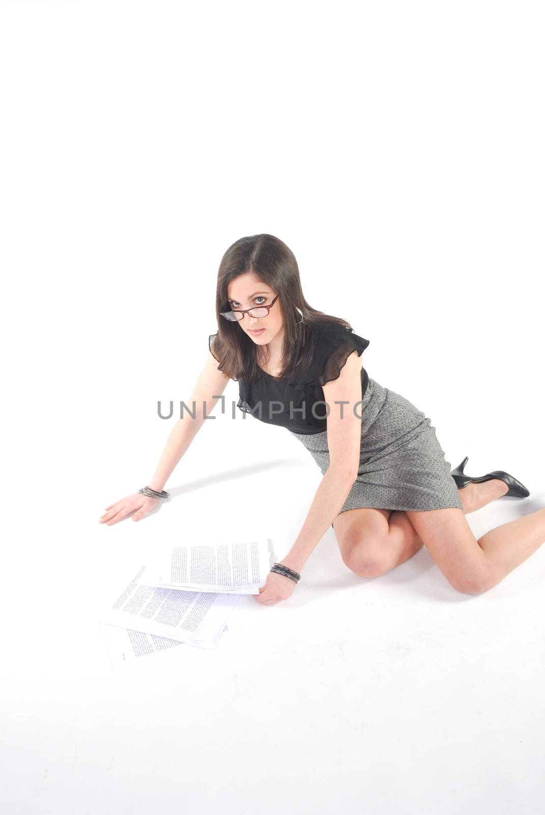 Business woman kneeling with papers