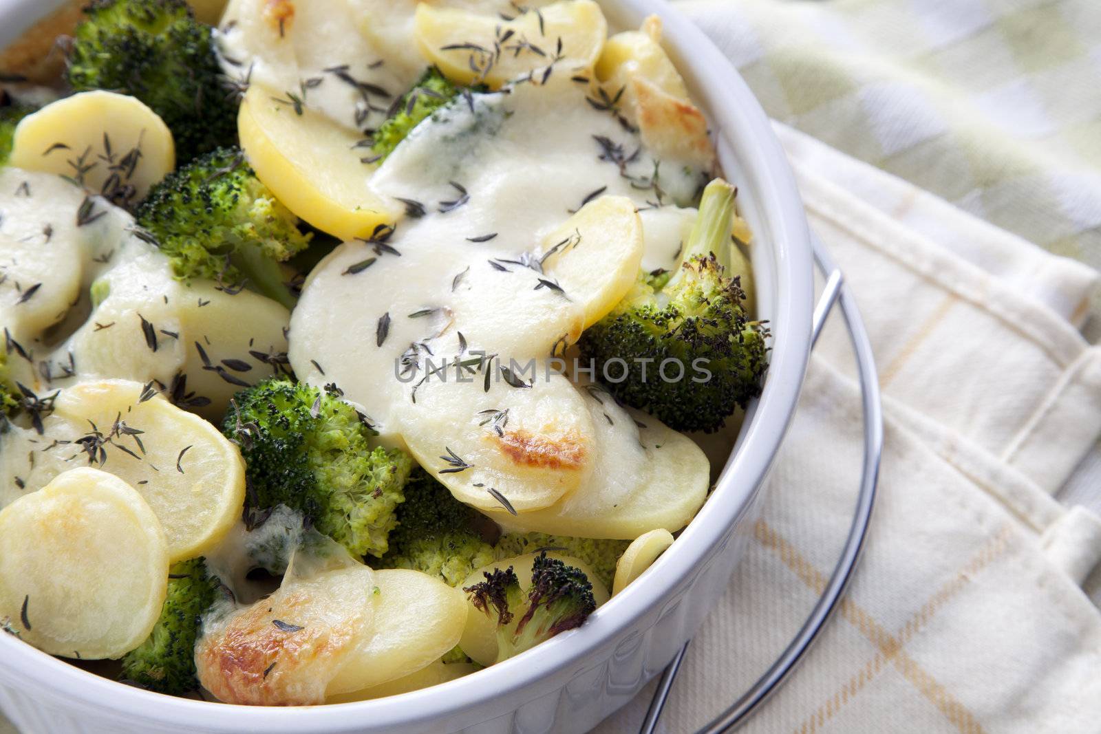 Vegetarian casserole with potatoes, broccoli and mozzarella cheese.