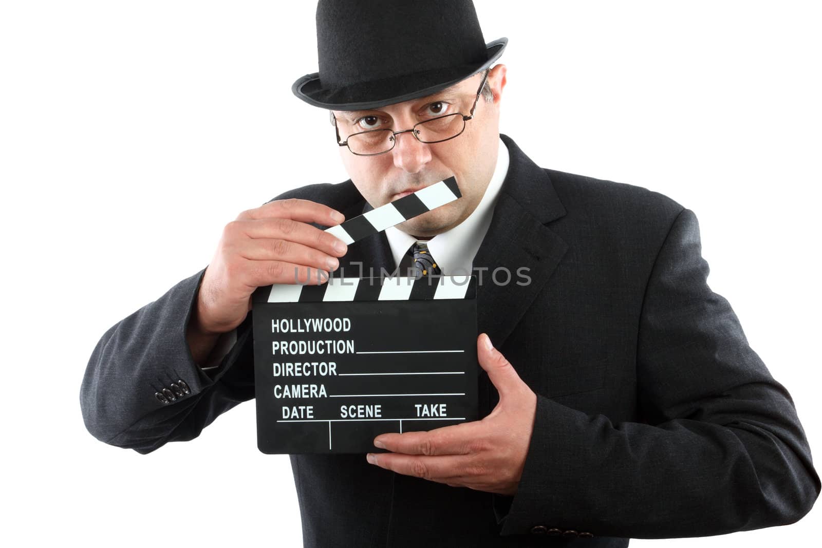 Old fashioned man holding movie clapboard 