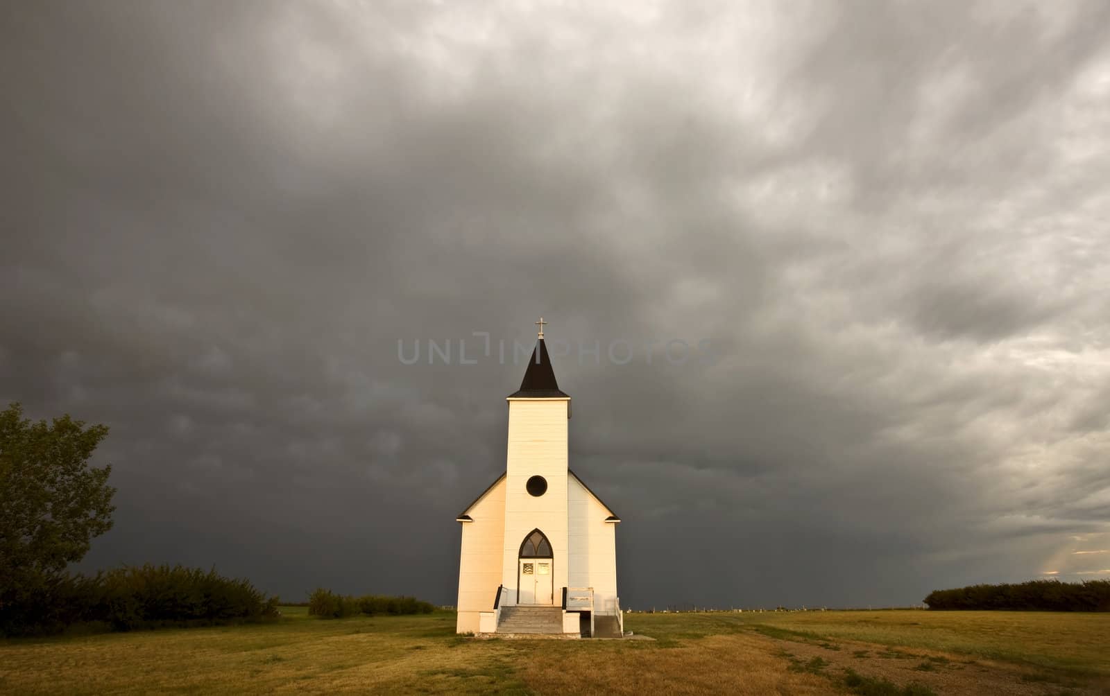 Storm Clouds and Church near Hodgeville Saskatchewan by pictureguy