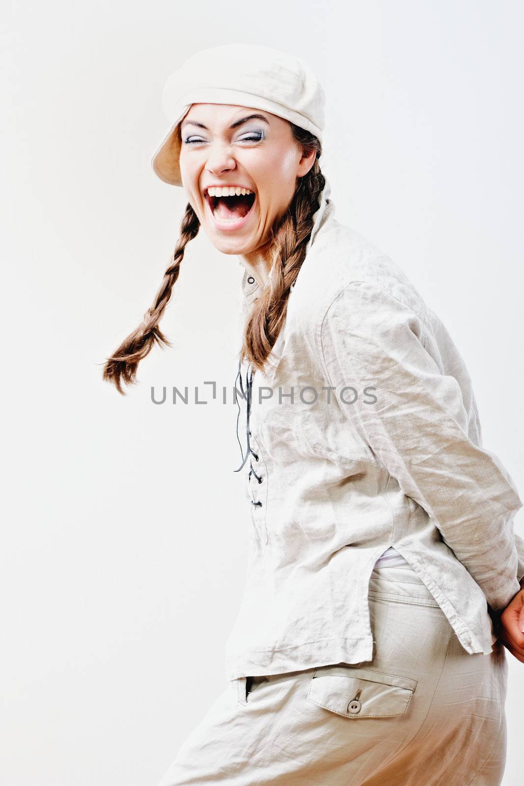 Young woman making a funny face. Isolated on white background