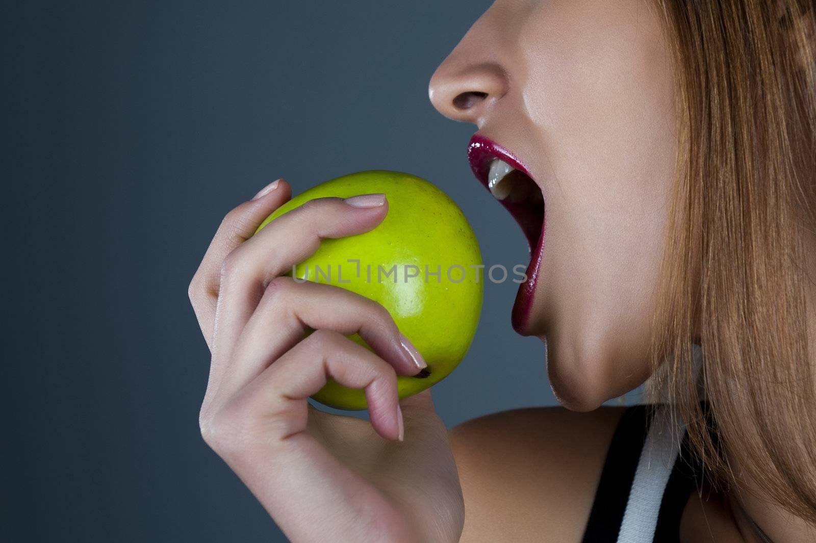 Sexual model with an apple in a hand
