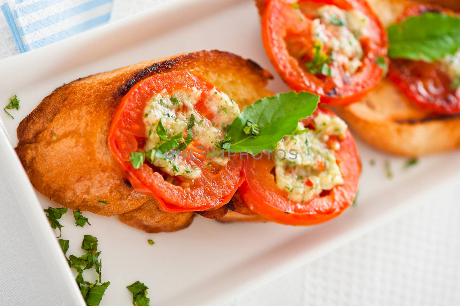 Bruschetta - gold baked baguette with tomato garlic and basil as appetizer