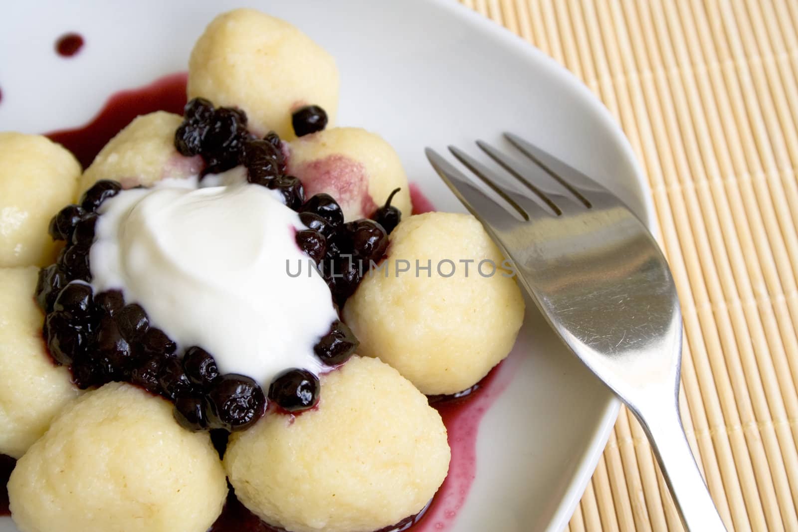 Sweet fruit dumplings with blueberries on the plate