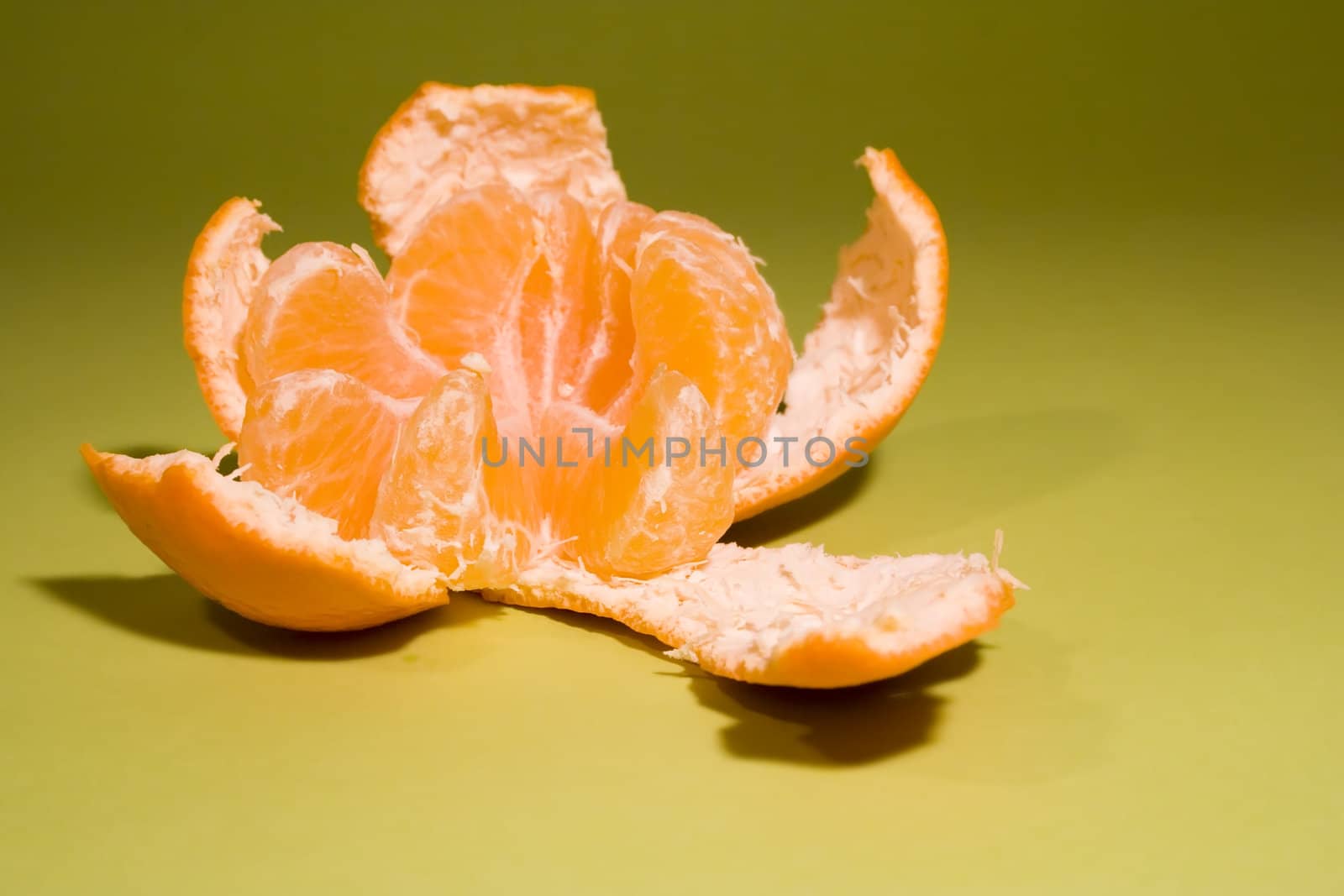 Delicious mandarine on fresh green background