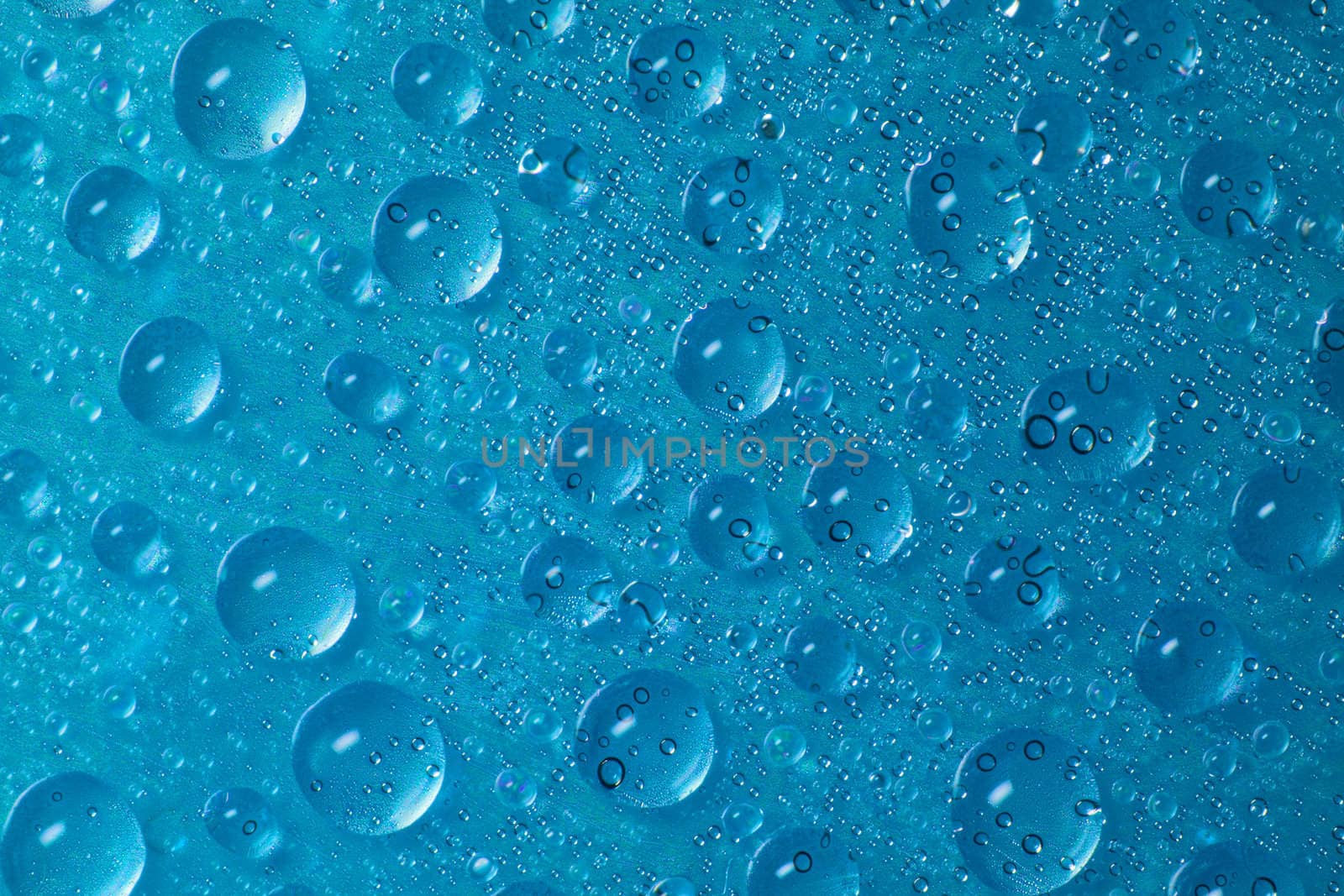 drops of water on blue background