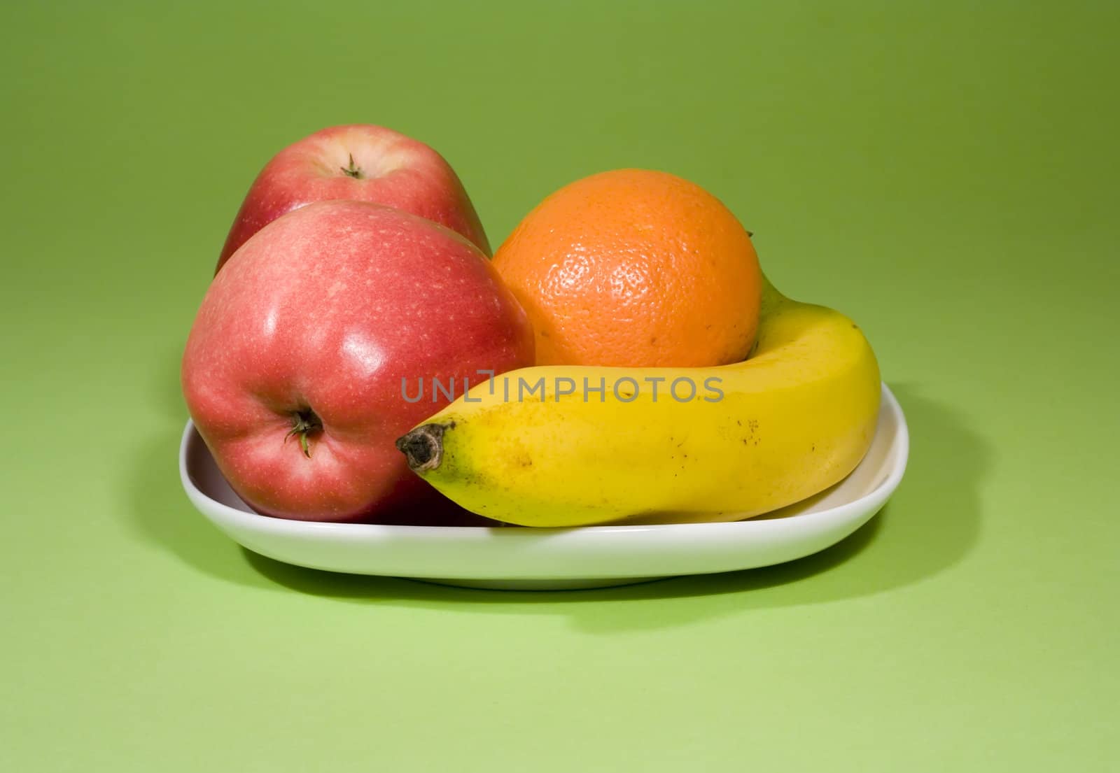 Juicy fruits on fresh green background