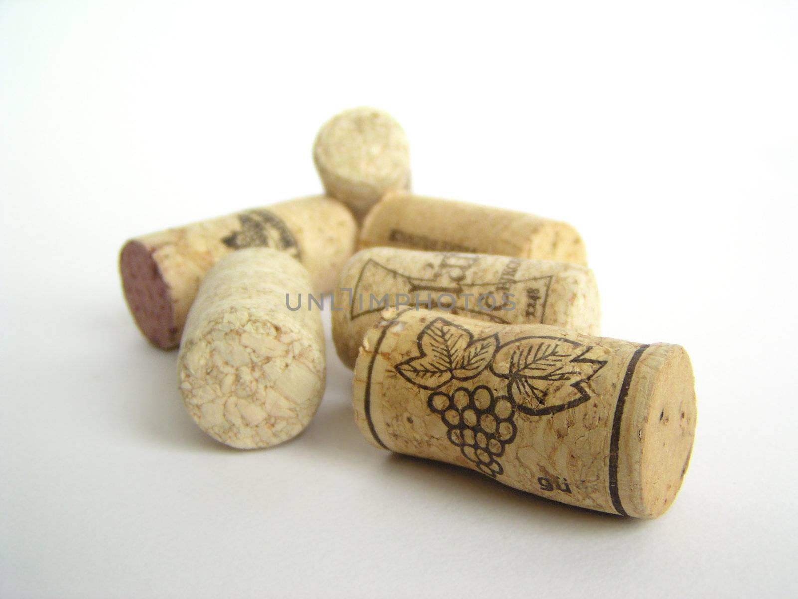 Natural cork wine stoppers on white background