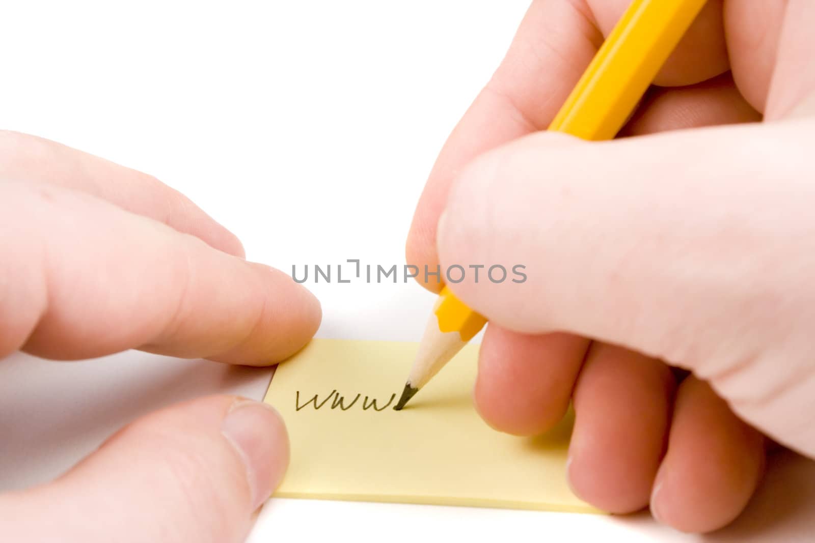 Writing web address on yellow paper
