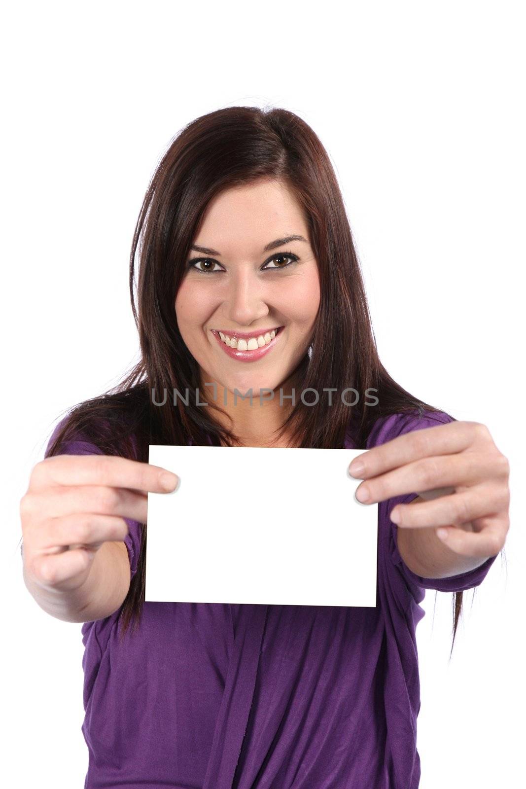 Lovely brunette woman with gorgeous smile holding a blank sign