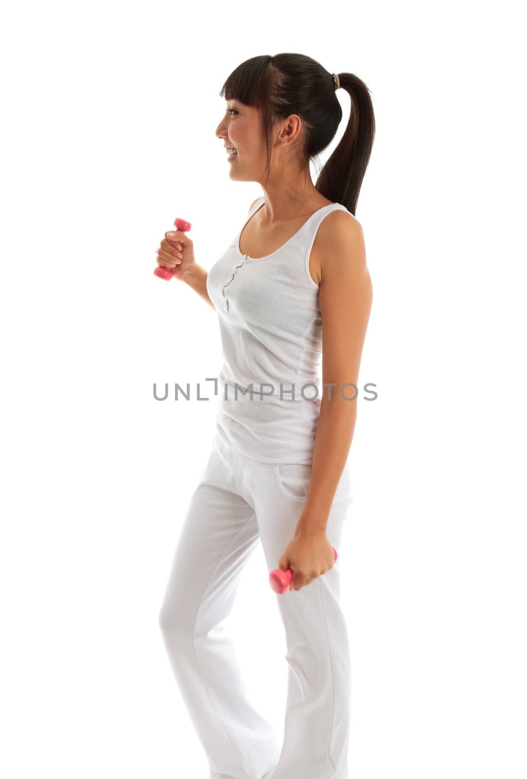 Beautiful young and happy girl exercising with hand weights to build muscle, firm and tone. She is wearing white pants and tank top.  There is motion in her hands and weights.  White background.

Model Jessica Elms, Makeup Hanae Satomura, Hair by Kayla Cifelli