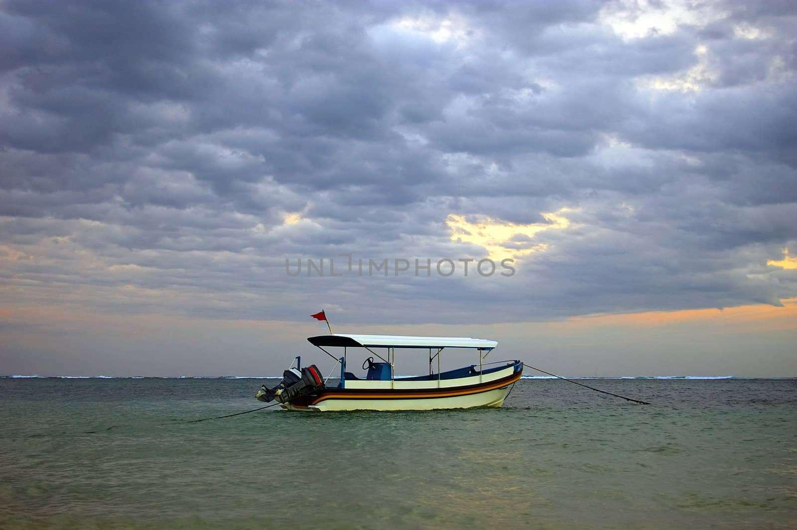 Boat anchored in the Indian ocean, Nusa Dua, Bali, Indonesia.