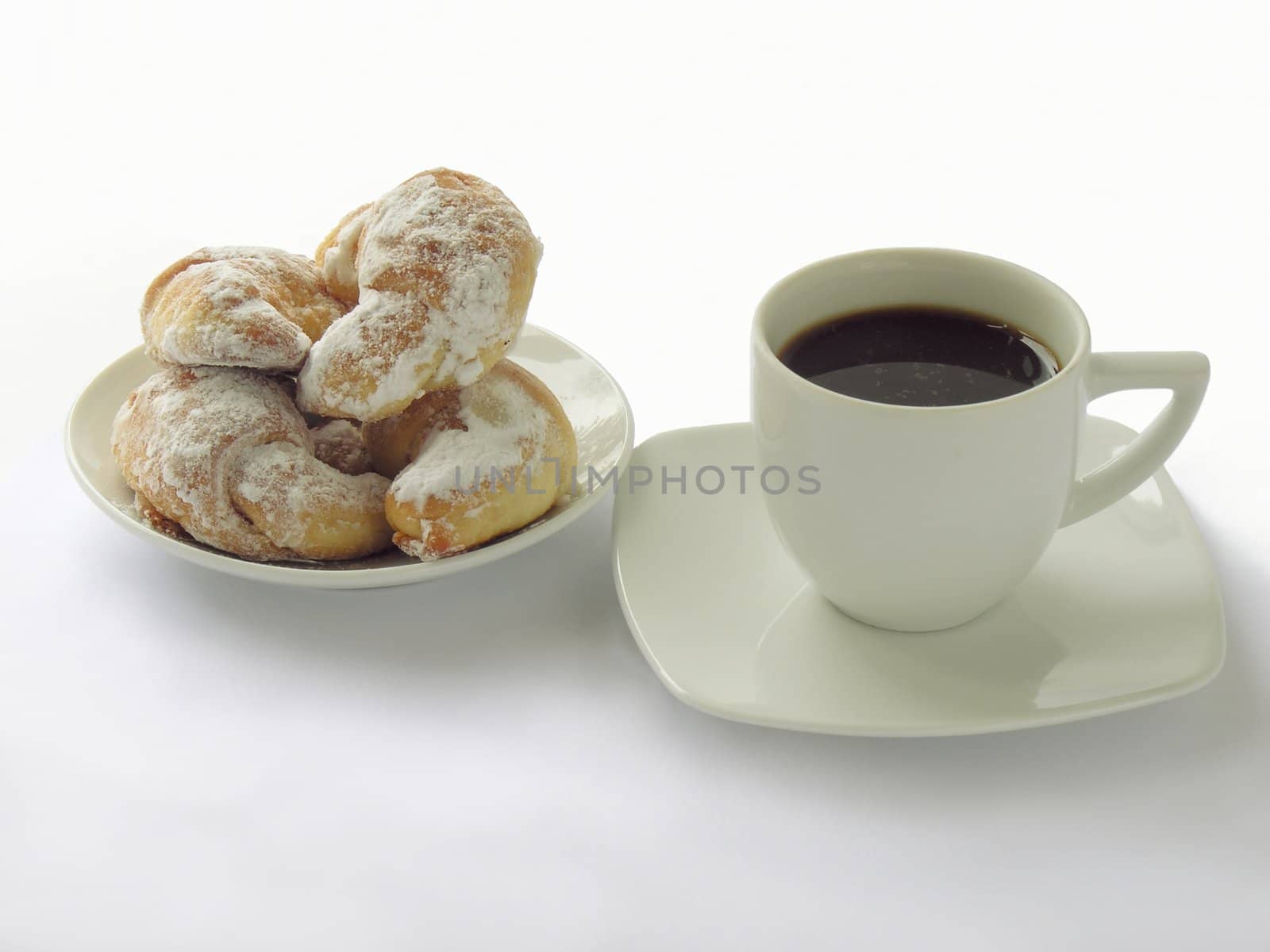 cup of black coffee and crisp sweet rolls by RAIMA