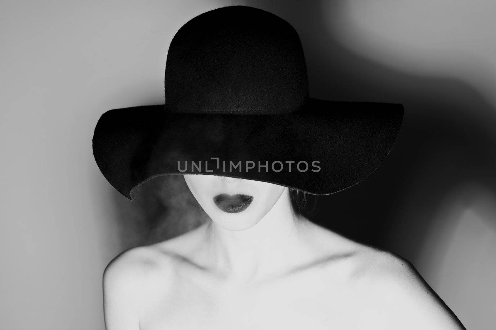 Hat and black lips