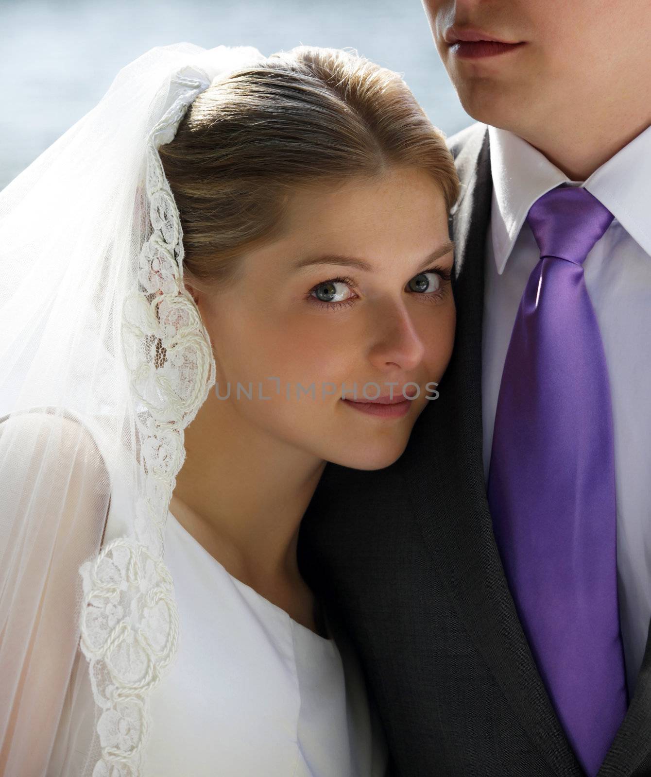 Happy newly-married couple in park