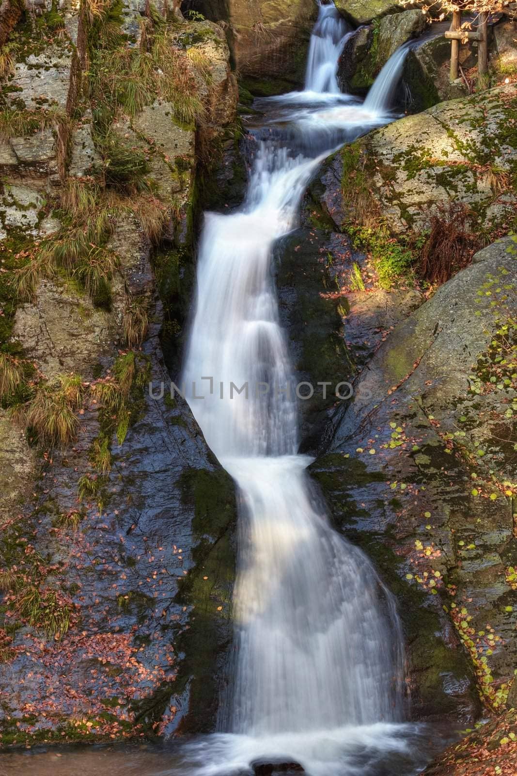 Shot of the fall of water. Stream Huntava - natural area - nature preserve.
Resov, Czech republic, Europe.