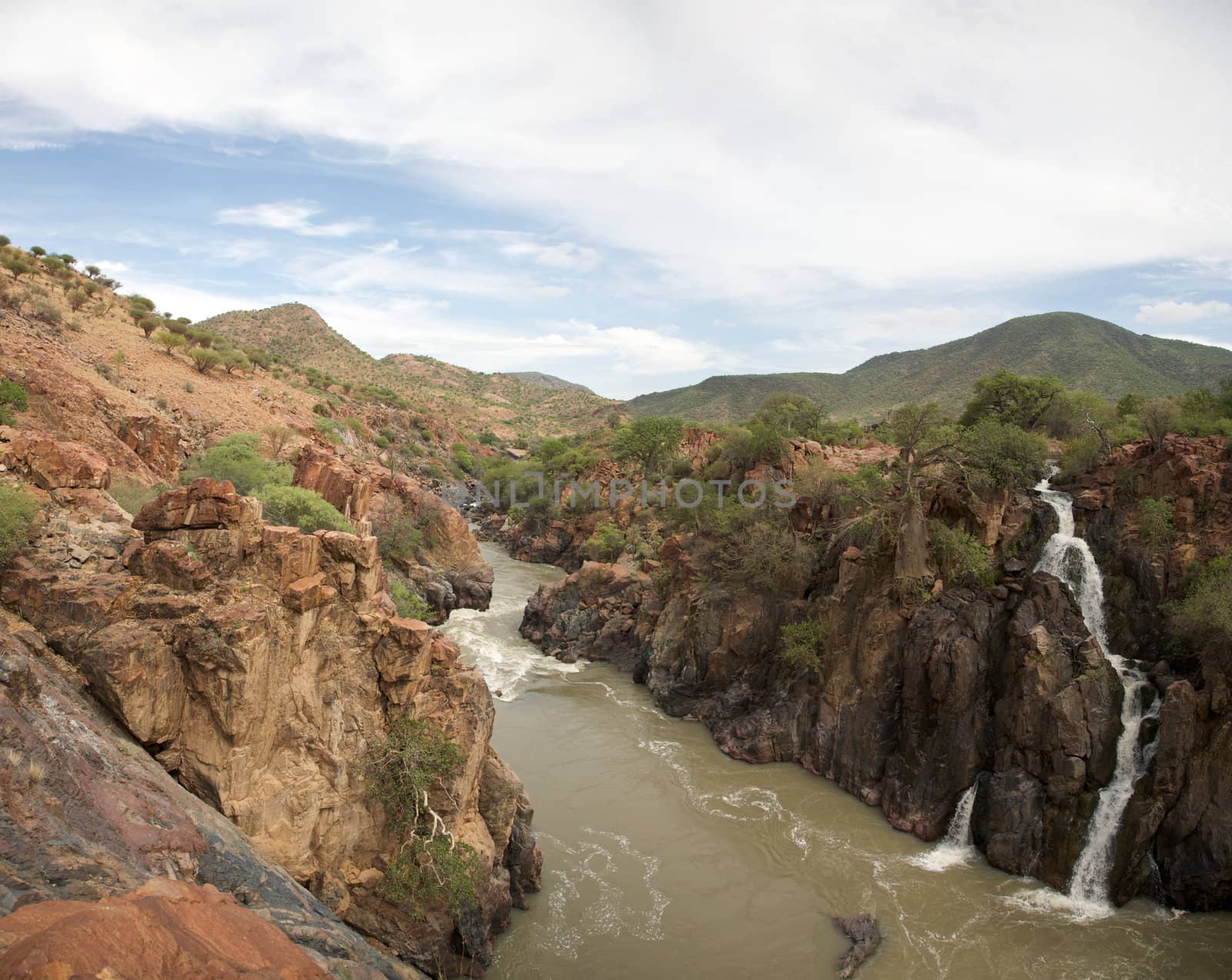 The Epupa Falls lie on the Kunene River, on the border of Angola and Namibia