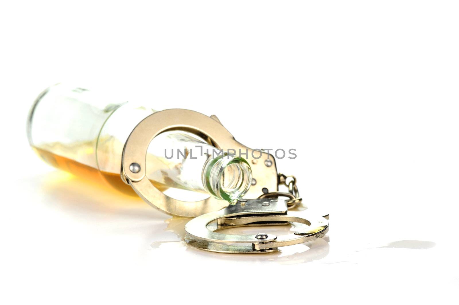 Concept photo showing relationship between alcohol and crime.